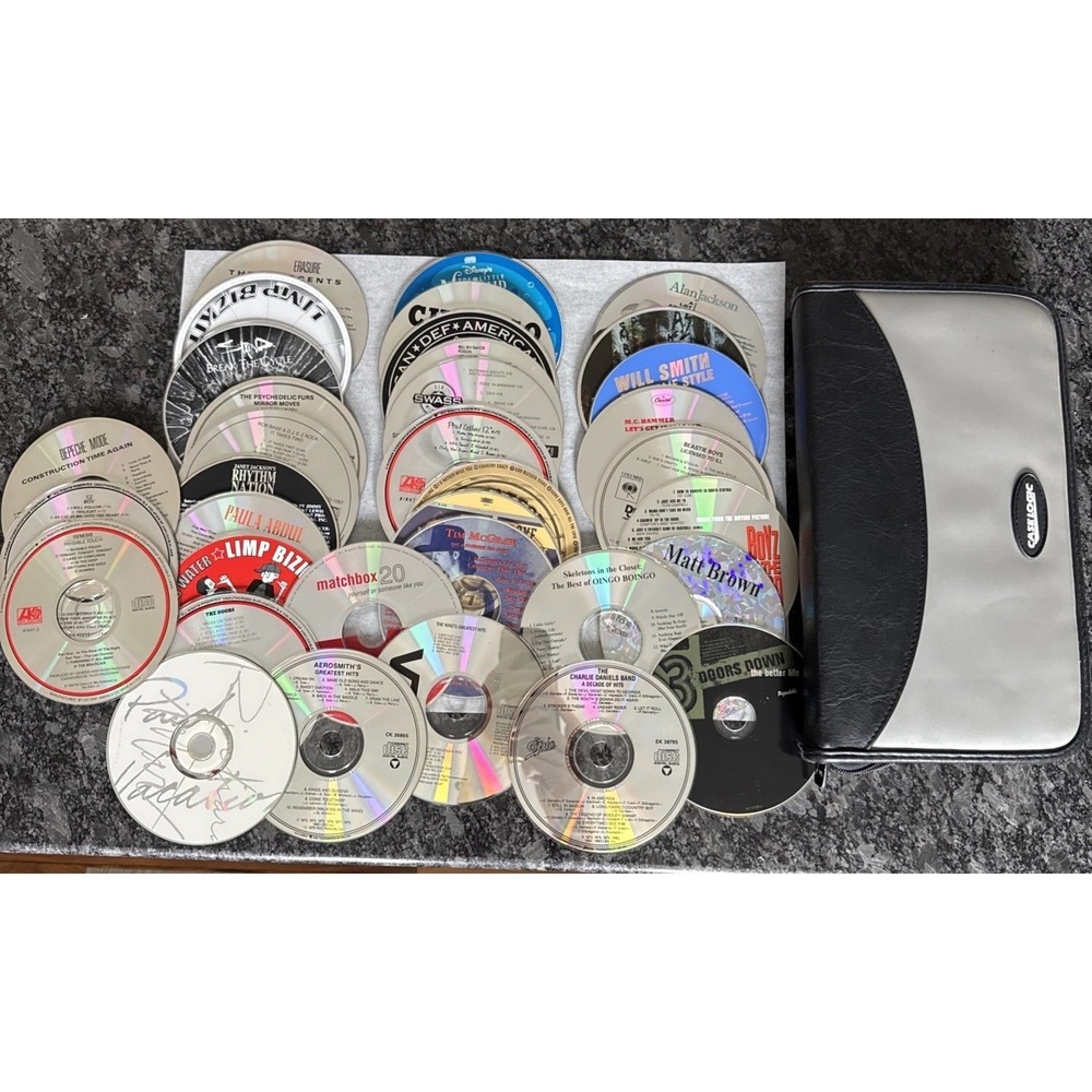 Case Logic CD Case With 35 Preowned CDs Rap, Classic Rock, Country, Hard Rock